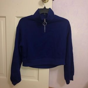 Cropped half zip sweater.